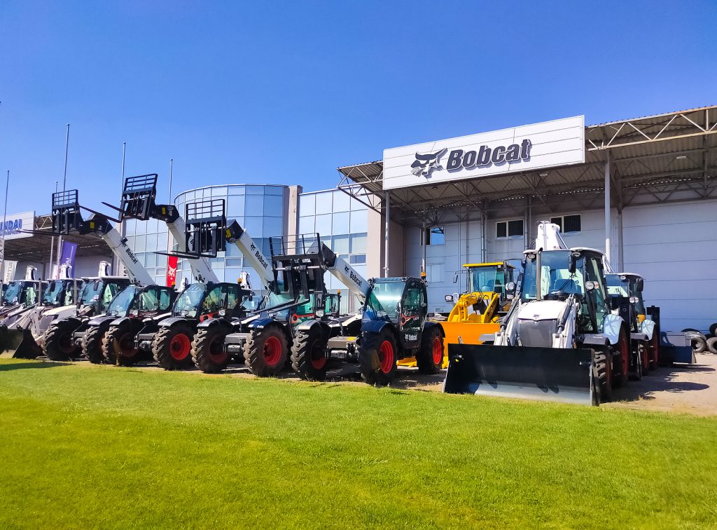 Bobcat - Skid steer loader Bobcat at road at Kyiv