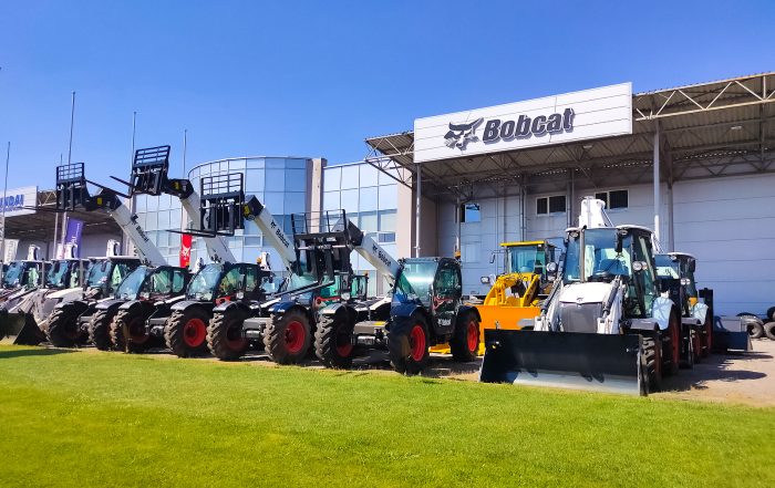 Bobcat - Skid steer loader Bobcat at road at Kyiv