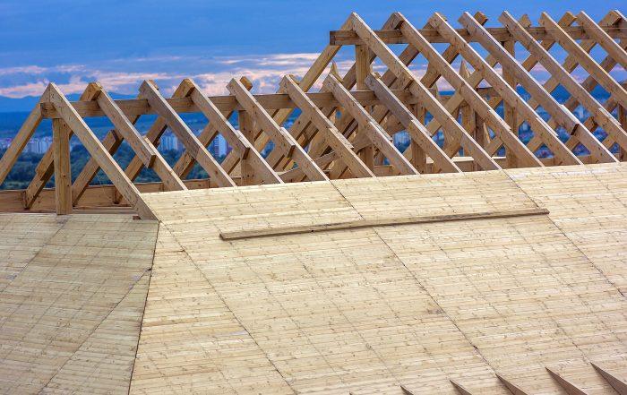 construction equipment dealers - House roof under construction.